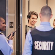 Wincon security guards help guests near condo elevator
